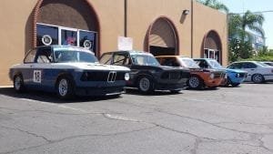 A lineup of classic BMWs ready for race day