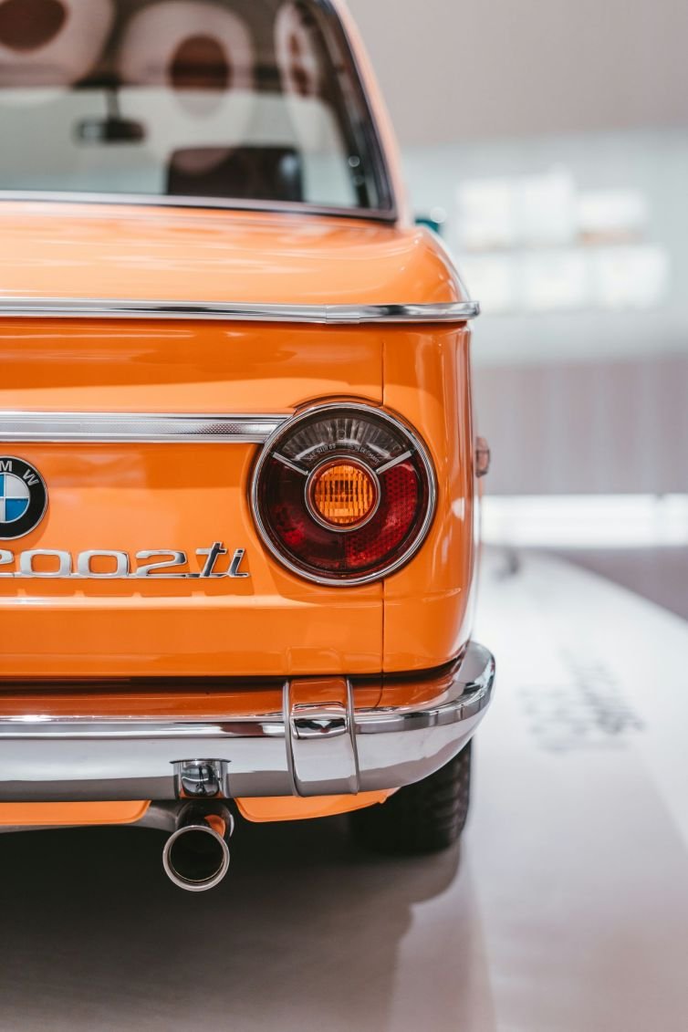 Photo of rear taillight section of an orange BMW 2002ti